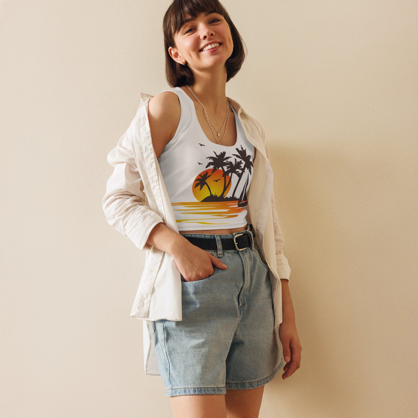 Women with white crop top and a picture of a island with sea and sand