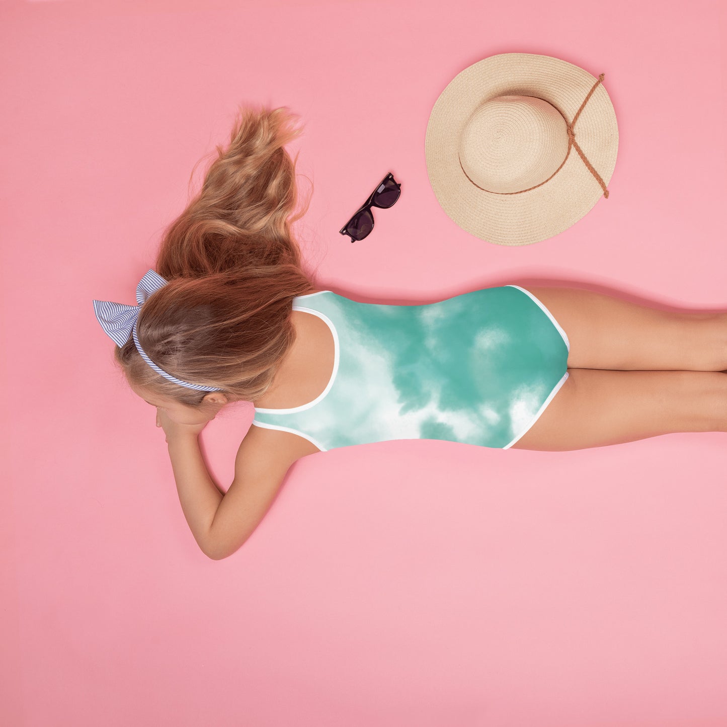 Girl wit swimsuit wit print of water playground