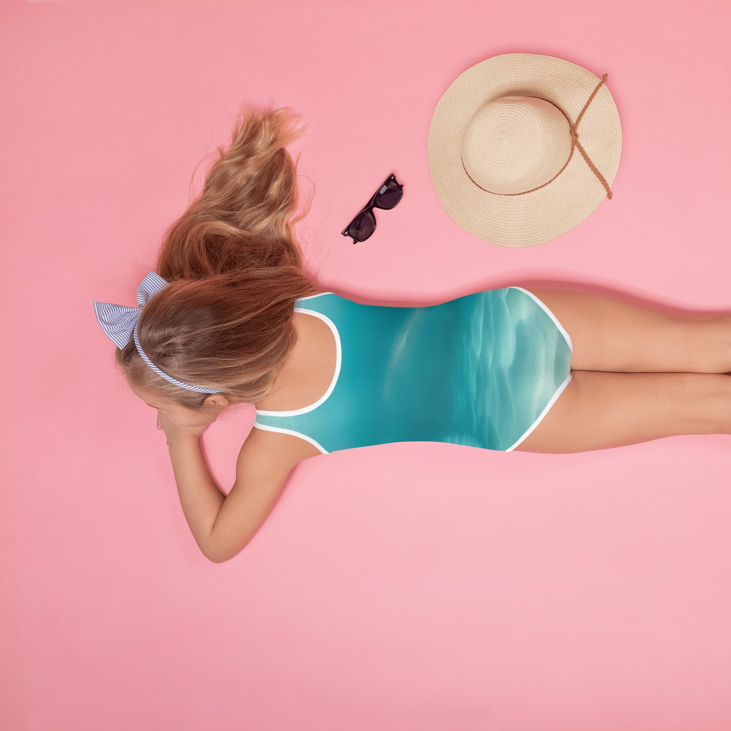 swimsuit for girls in ocean blue and a print of a hammerhead shark