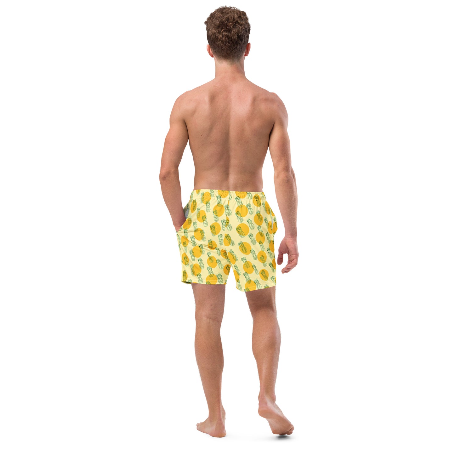 Men with yellow swim trunk and print of pineapples on it