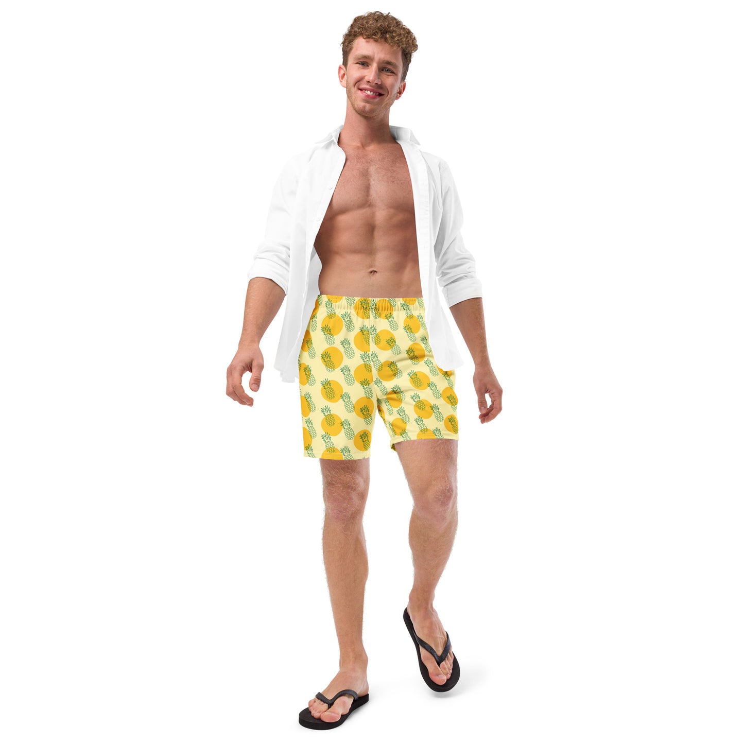 Men with yellow swim trunk and print of pineapples on it