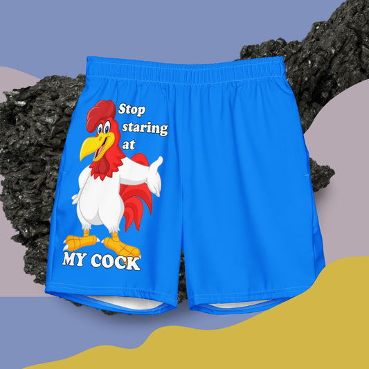 Blue swimming trunks with a picture of a rooster and the text "Stop staring at MY COCK"
