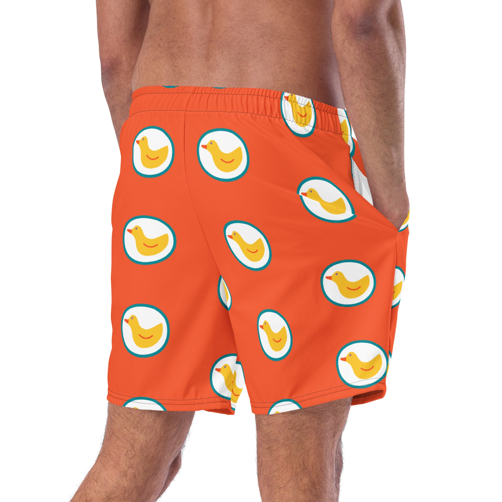 Men with Orange swim trunks with print of ducks