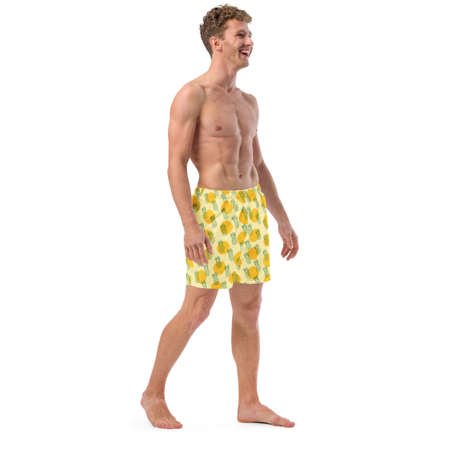 Men with yellow swim trunk and print of pineapples on it