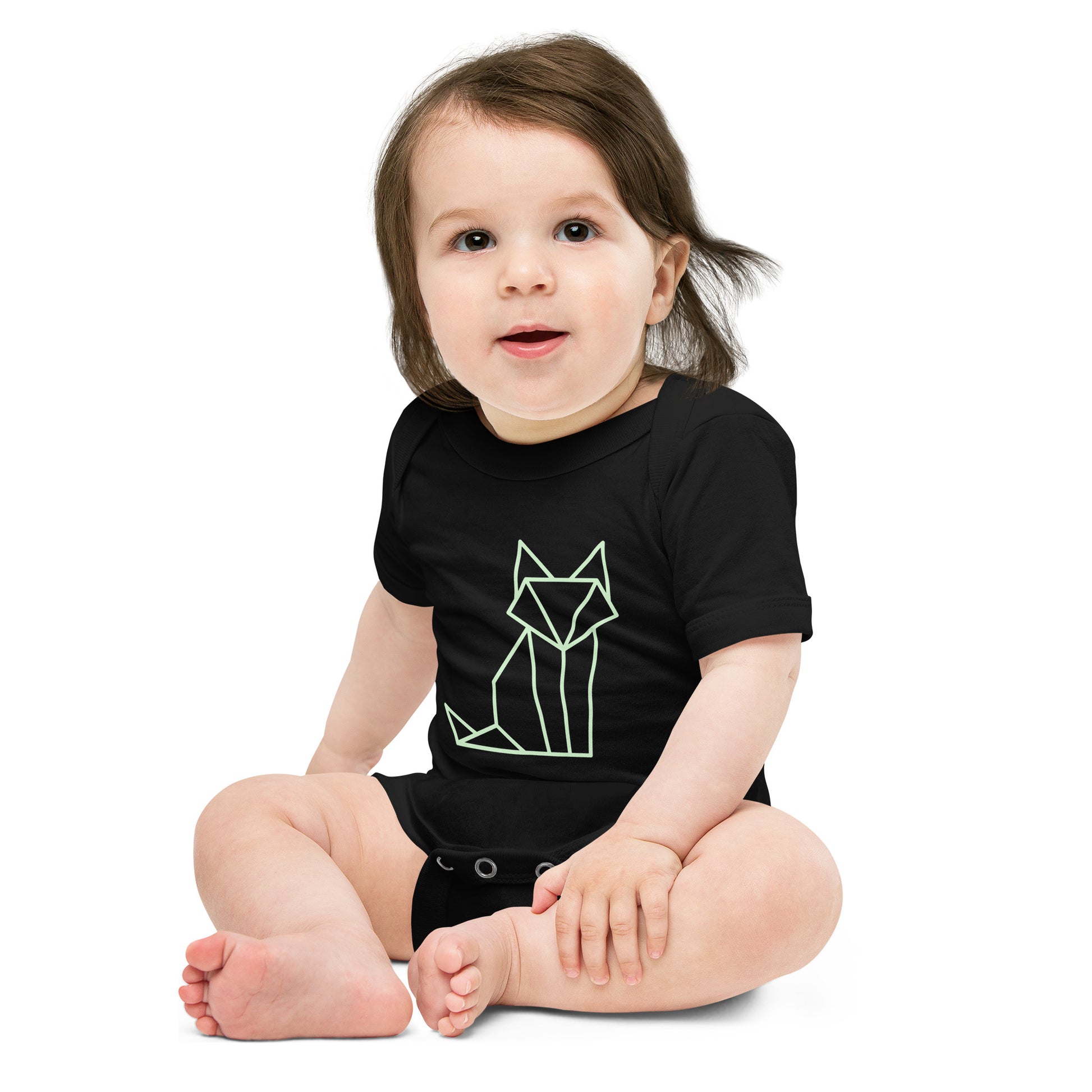 Baby with a black short sleeve one piece with a print of a fox in green