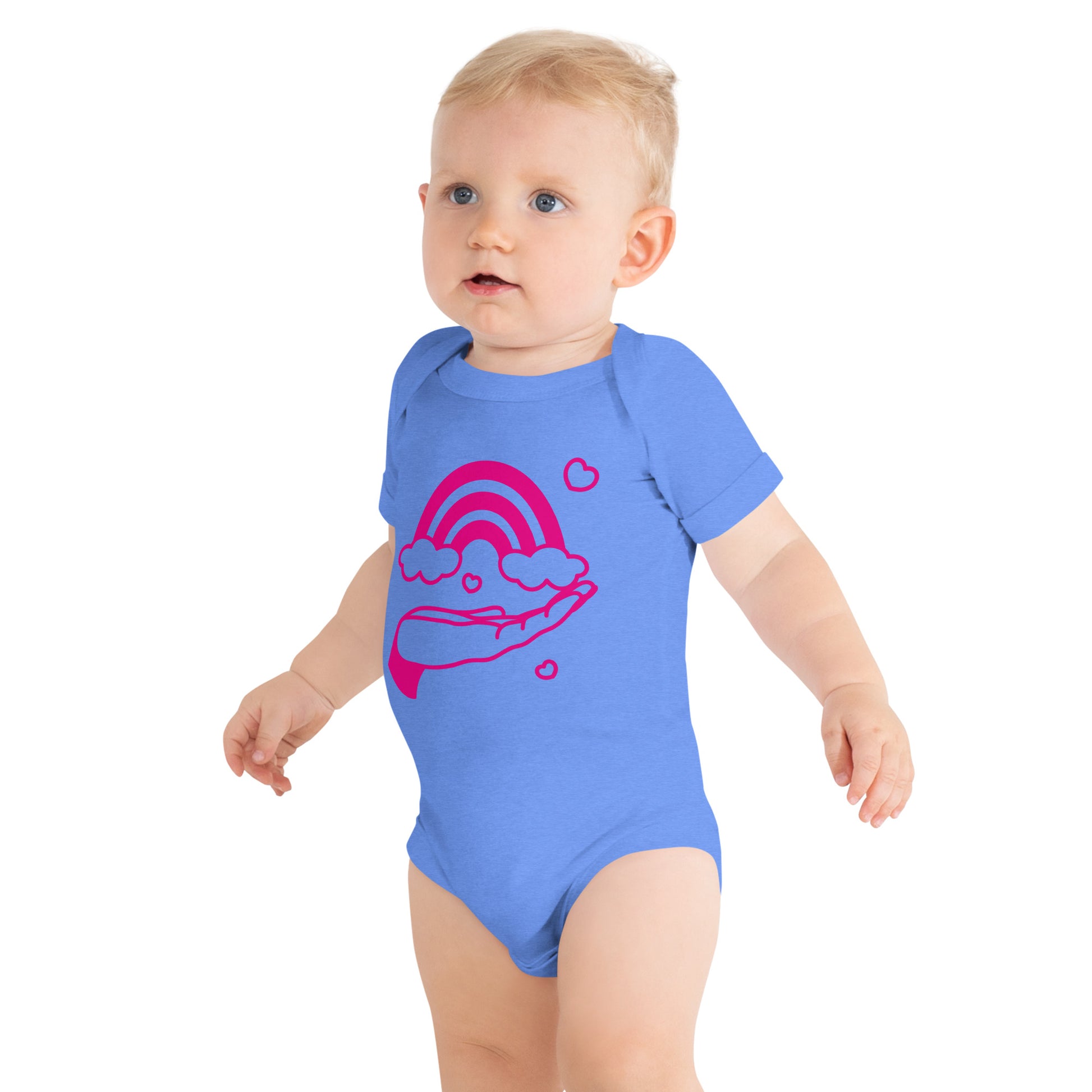 baby with columbia blue short sleeve one piece with print of pink hand holding a pink rainbow