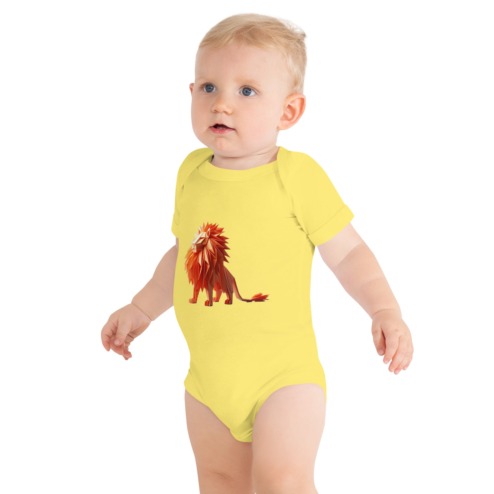 Baby with a yellow bodysuit with a print of a lion