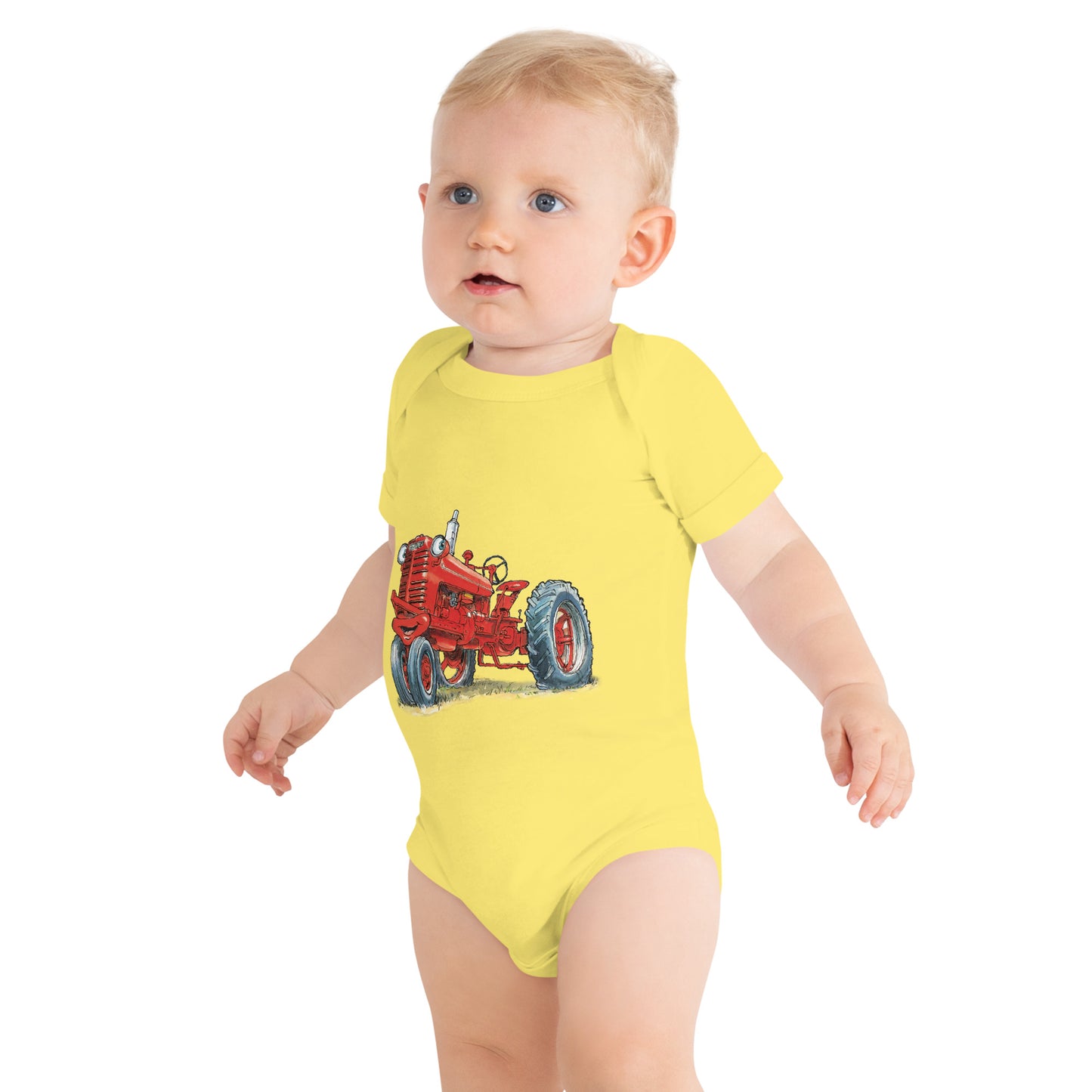 Baby with yellow body and a print of a red tractor