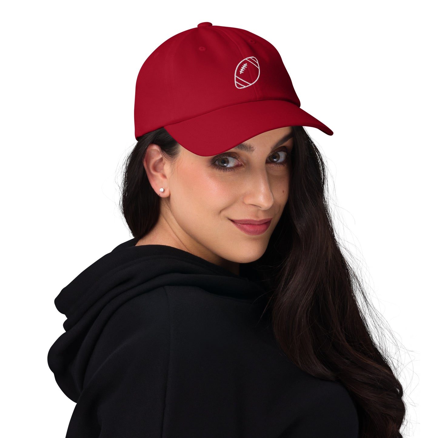 women with red baseball cap with football