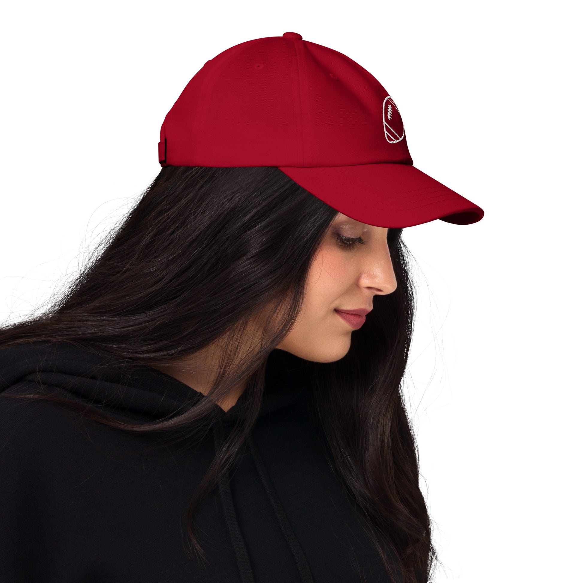 women with red baseball cap with football