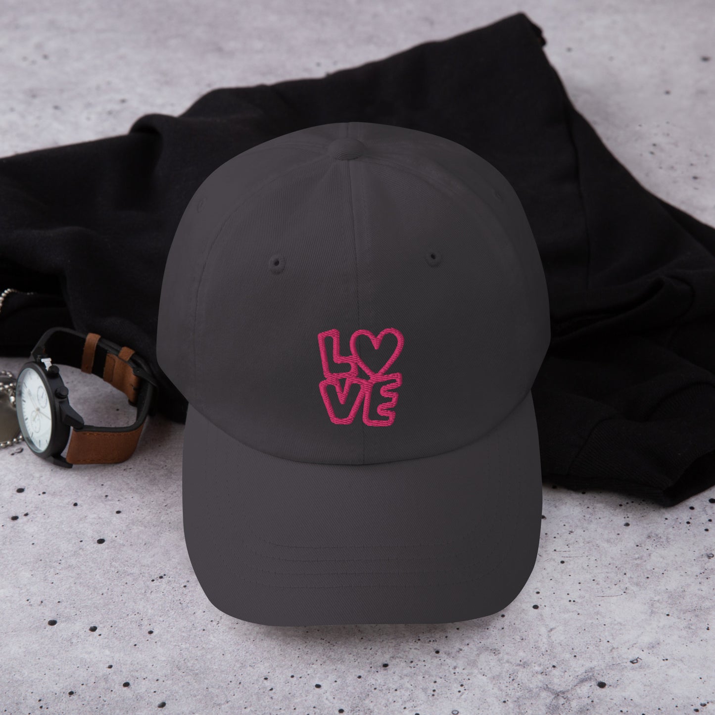 Dark grey Hat with the pink letters LOVE with the O in heart shape