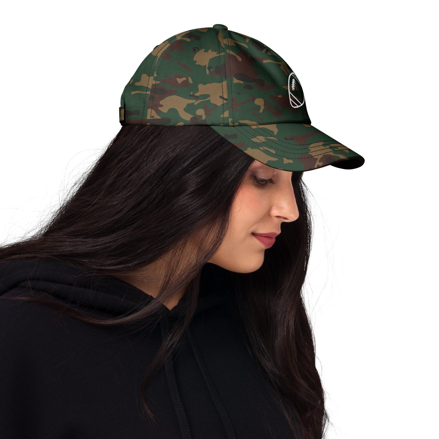 women with green camo baseball cap with football