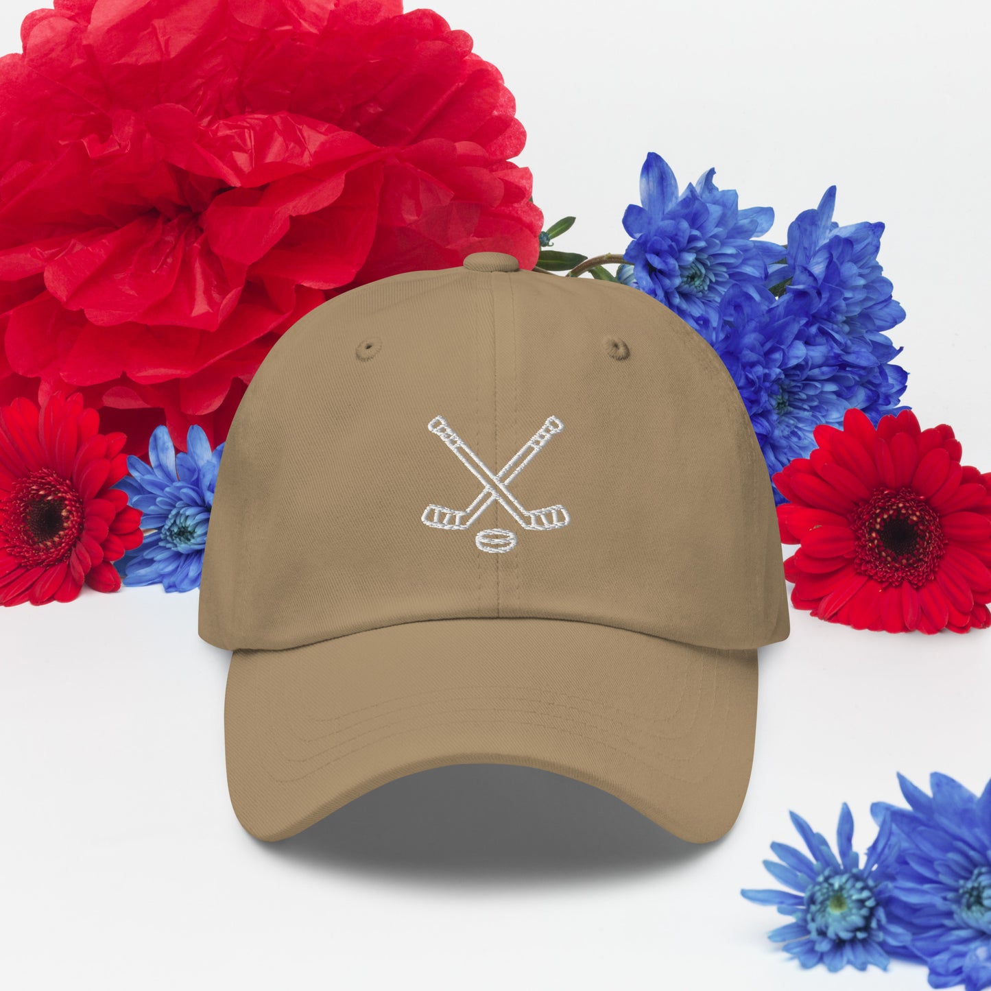 Khaki hat with print of hockeysticks and puck