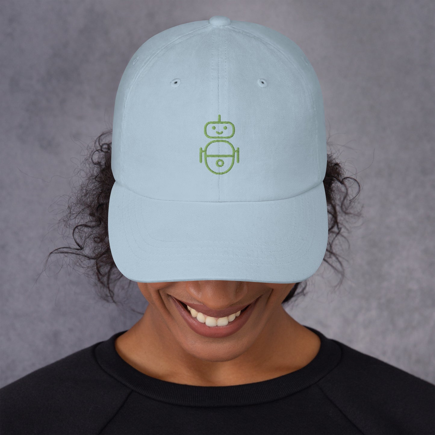 Women with light blue hat with in green Android logo
