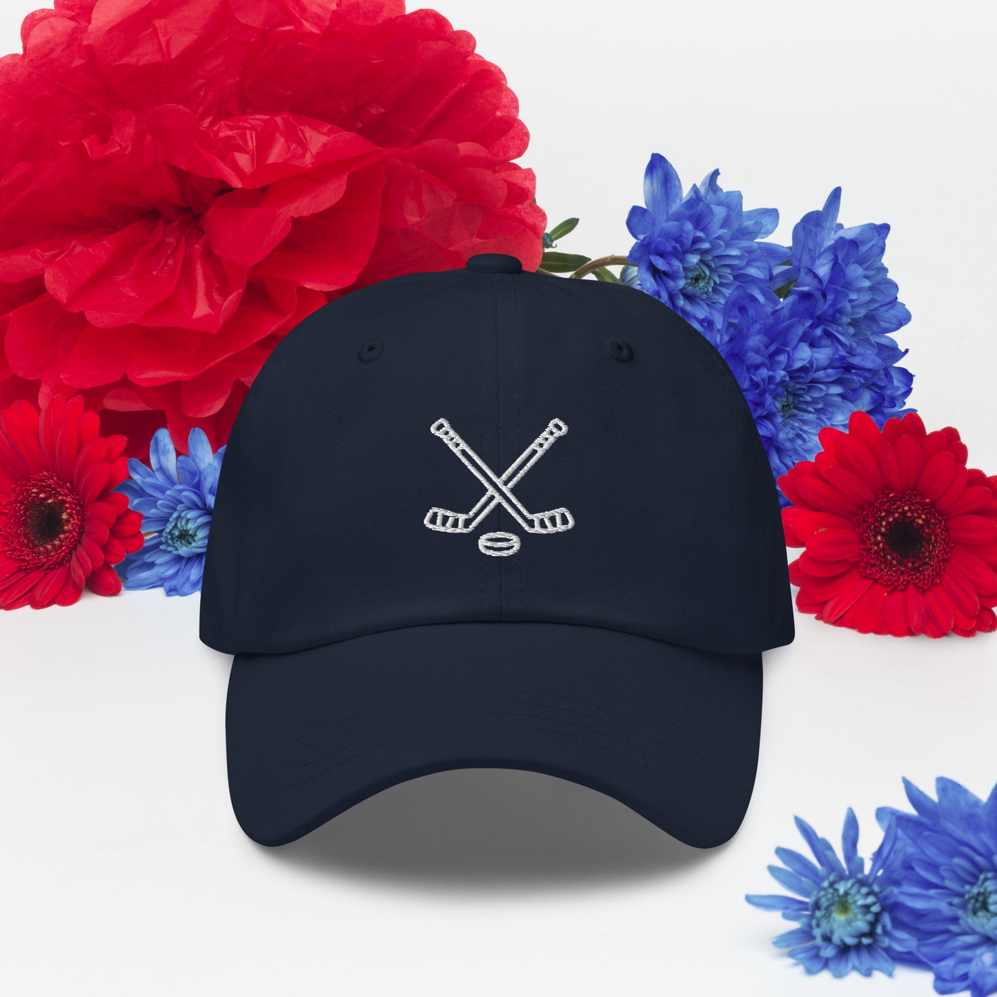 Navy hat with print of hockeysticks and puk
