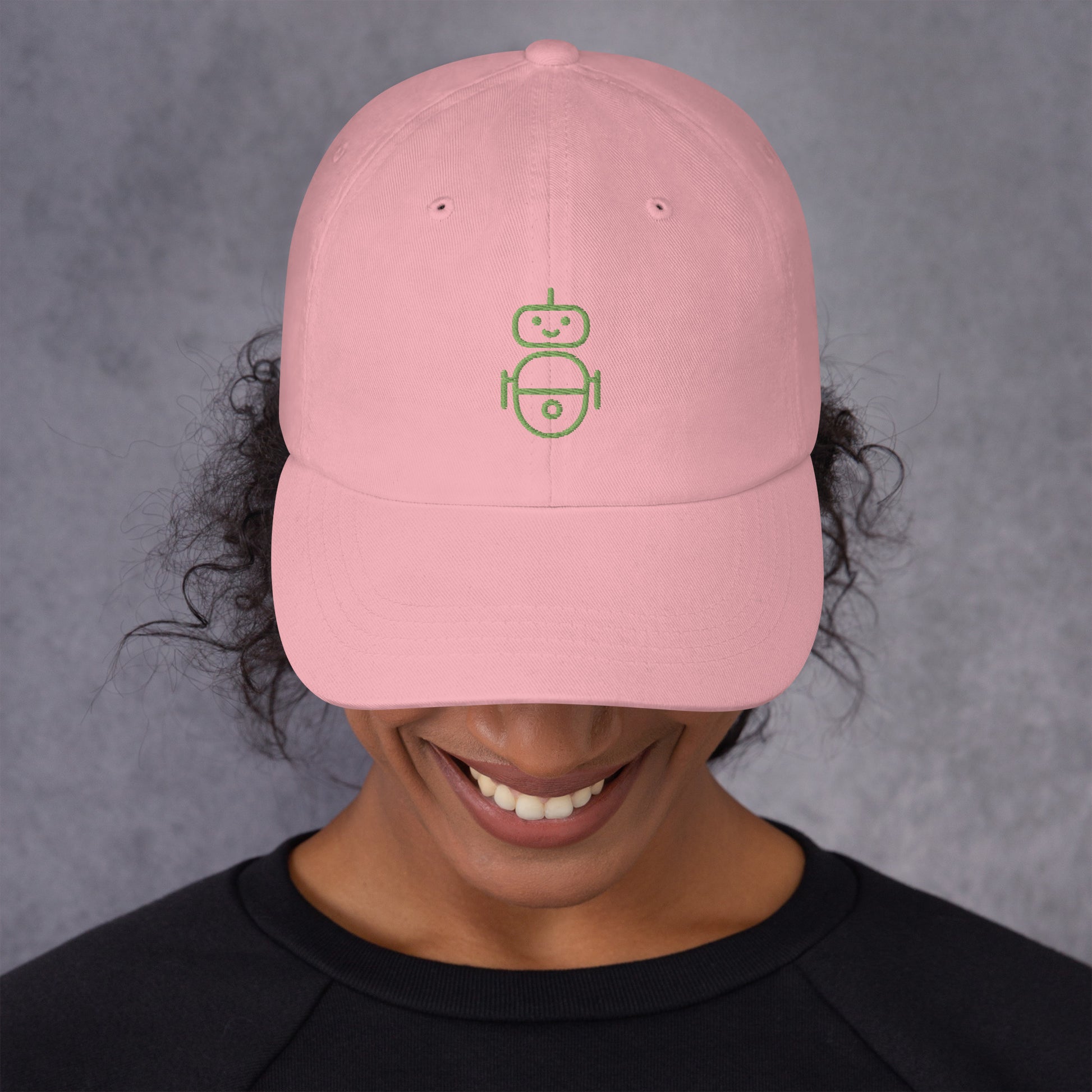 Women with pink hat with in green Android logo