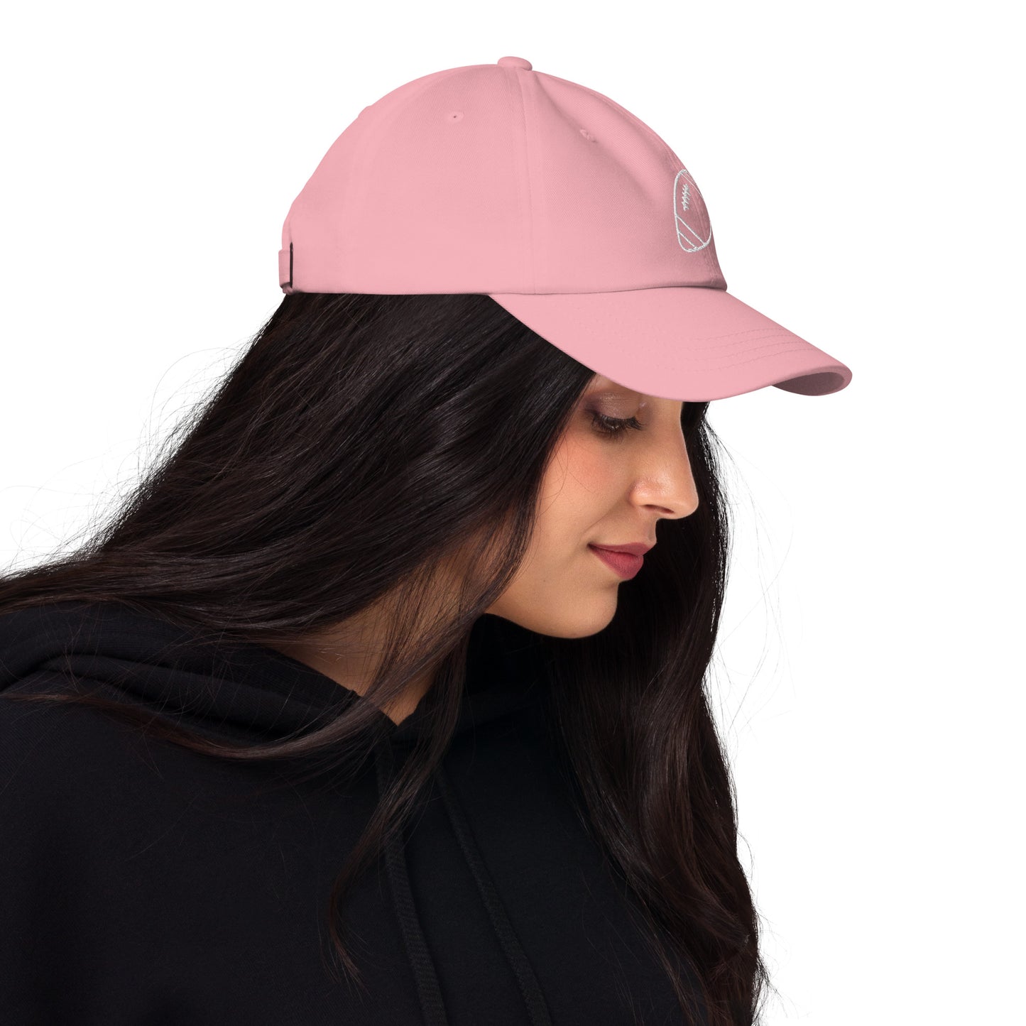 women with pink baseball cap with football