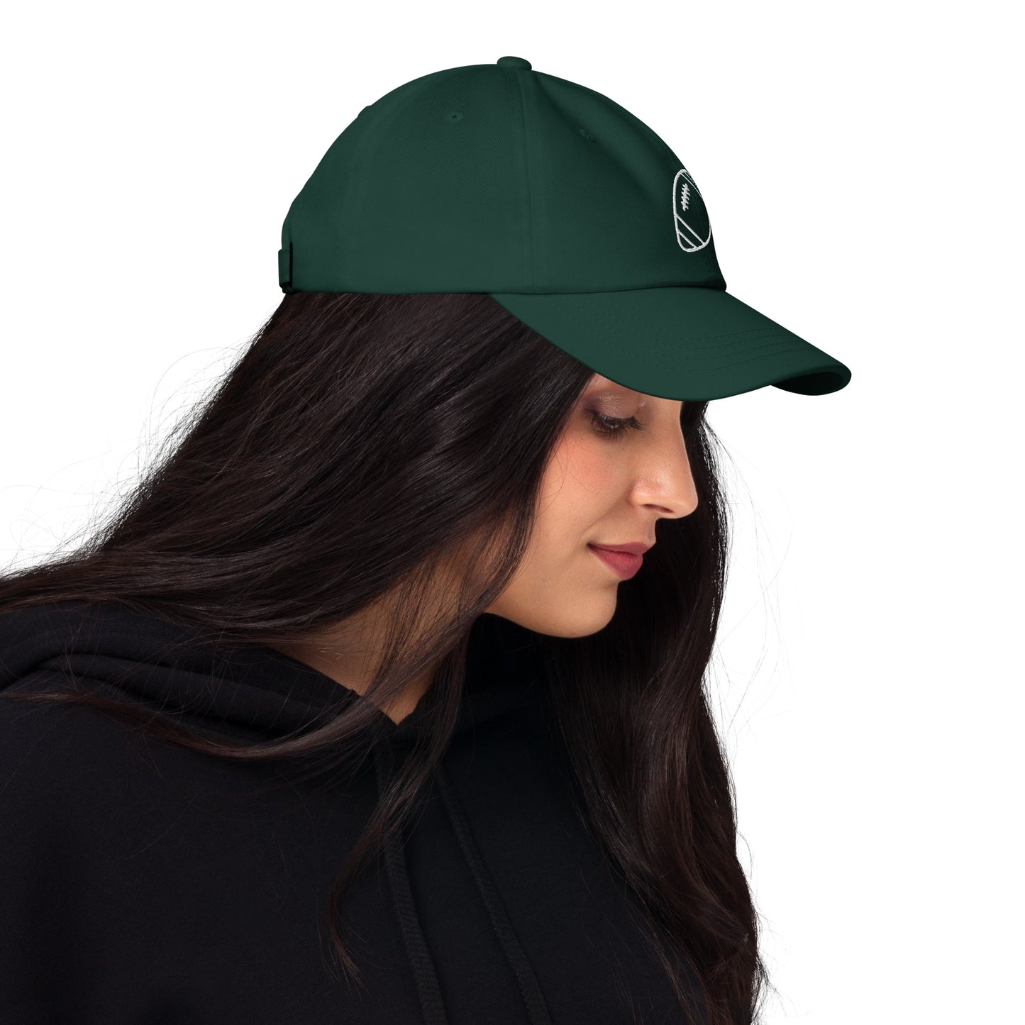 women with green baseball cap with football