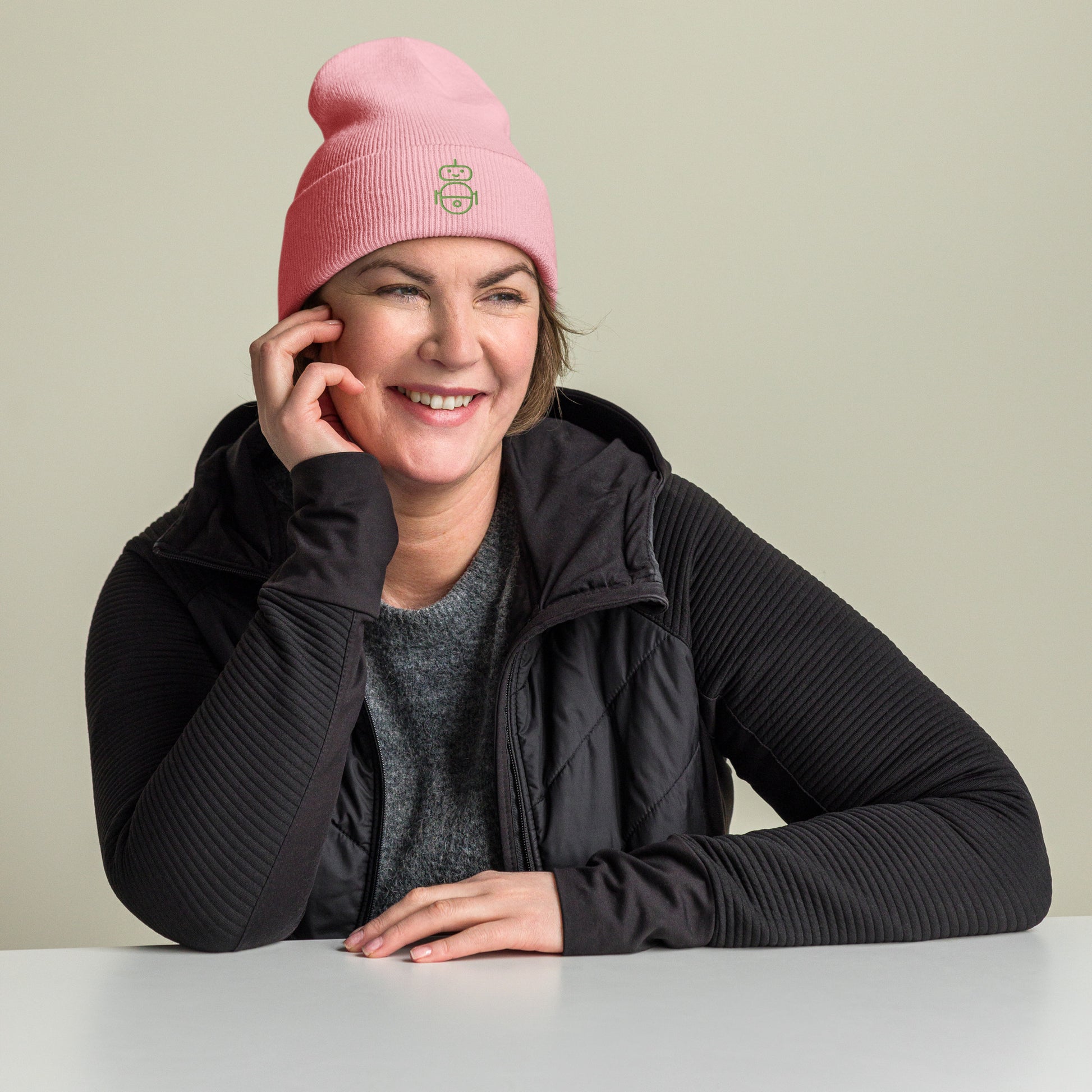 Women with pink beanie and Android logo in green