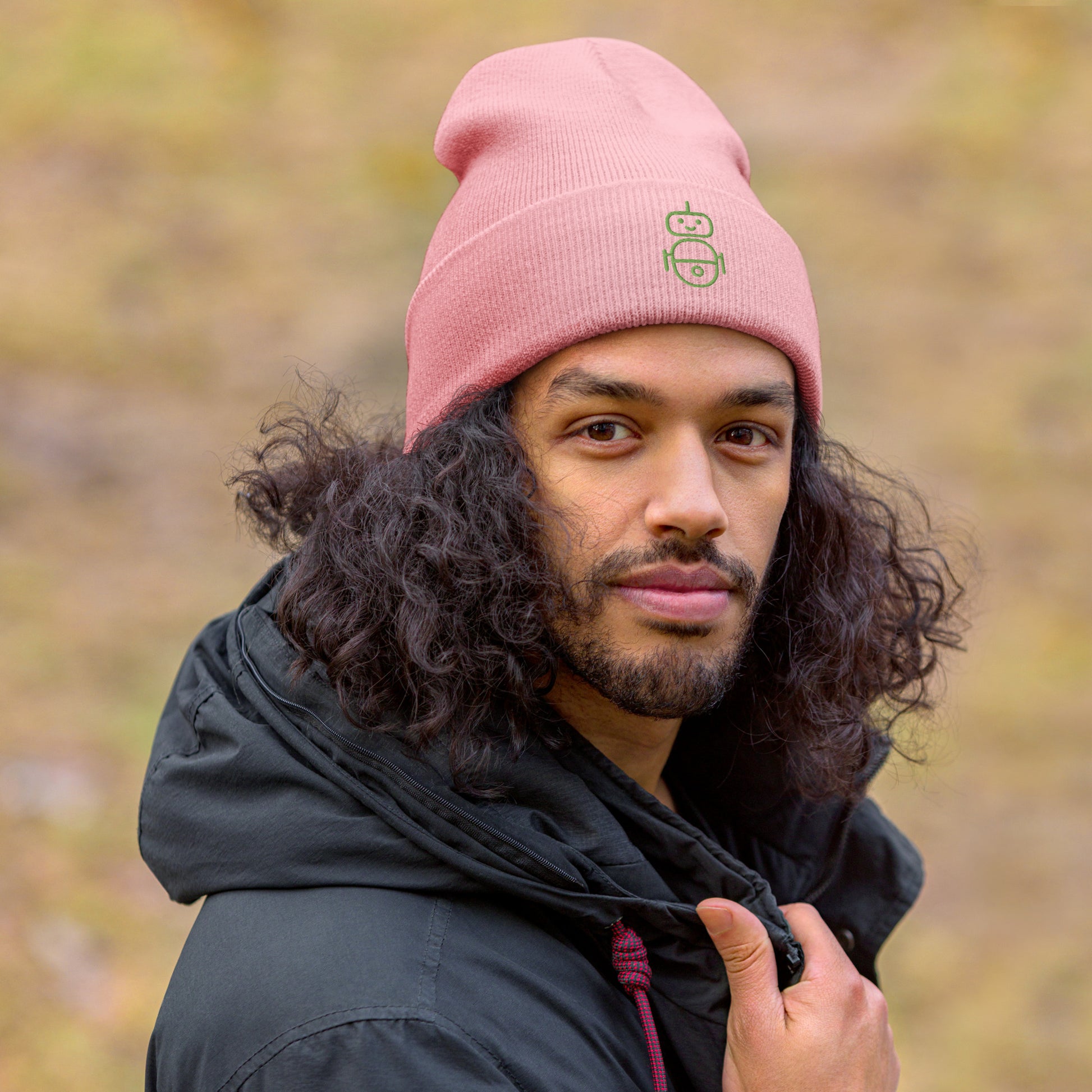 Men with pink beanie and Android logo in green