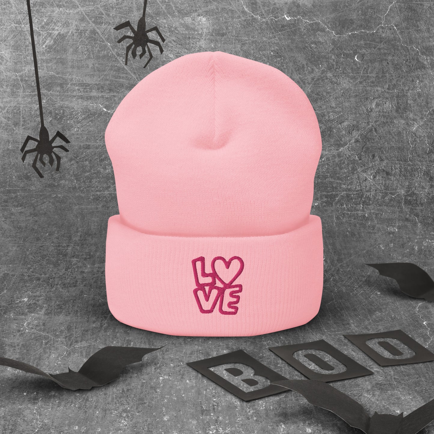 Pink beanie with the pink letters LOVE with the O in heart shape