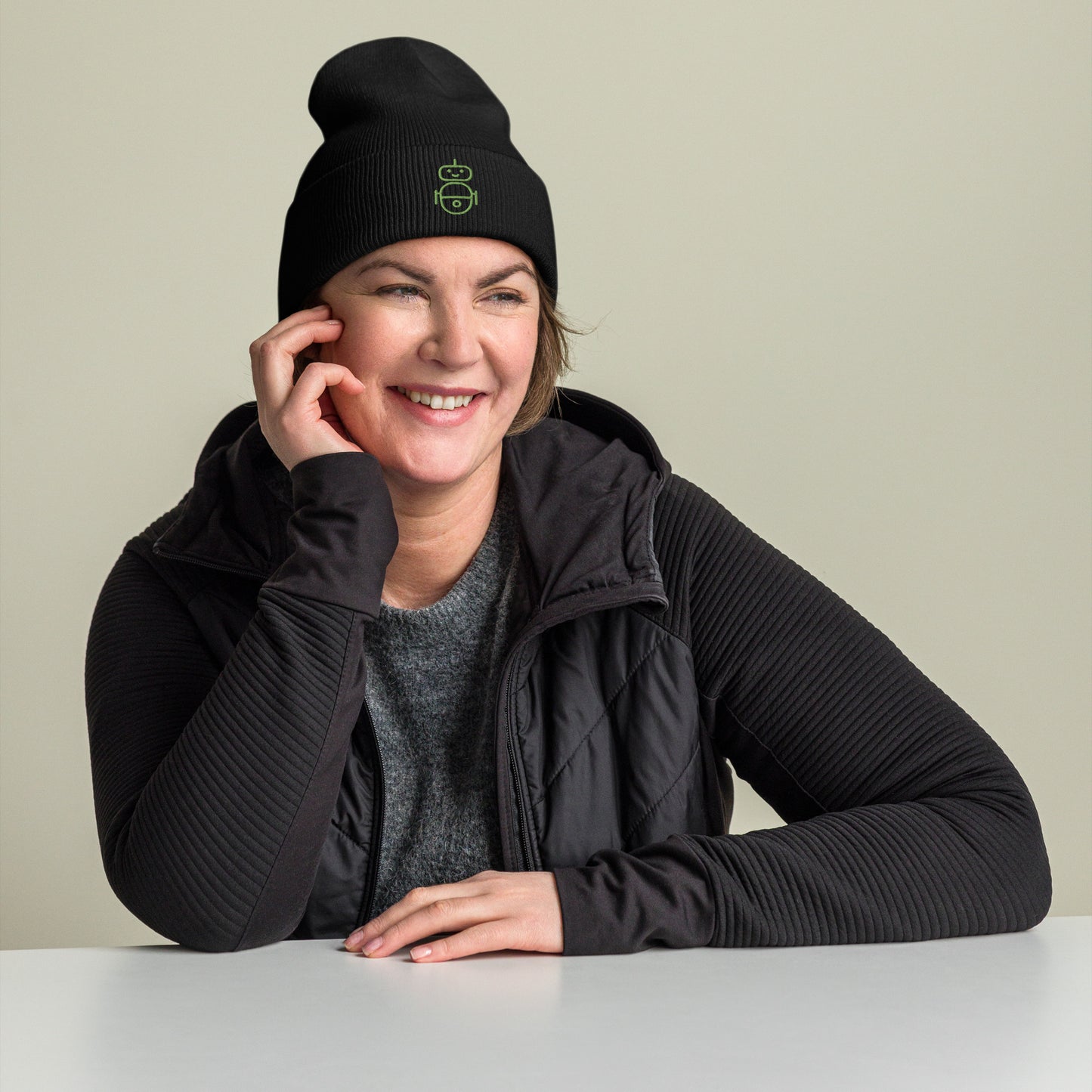 Women with black beanie and Android logo in green