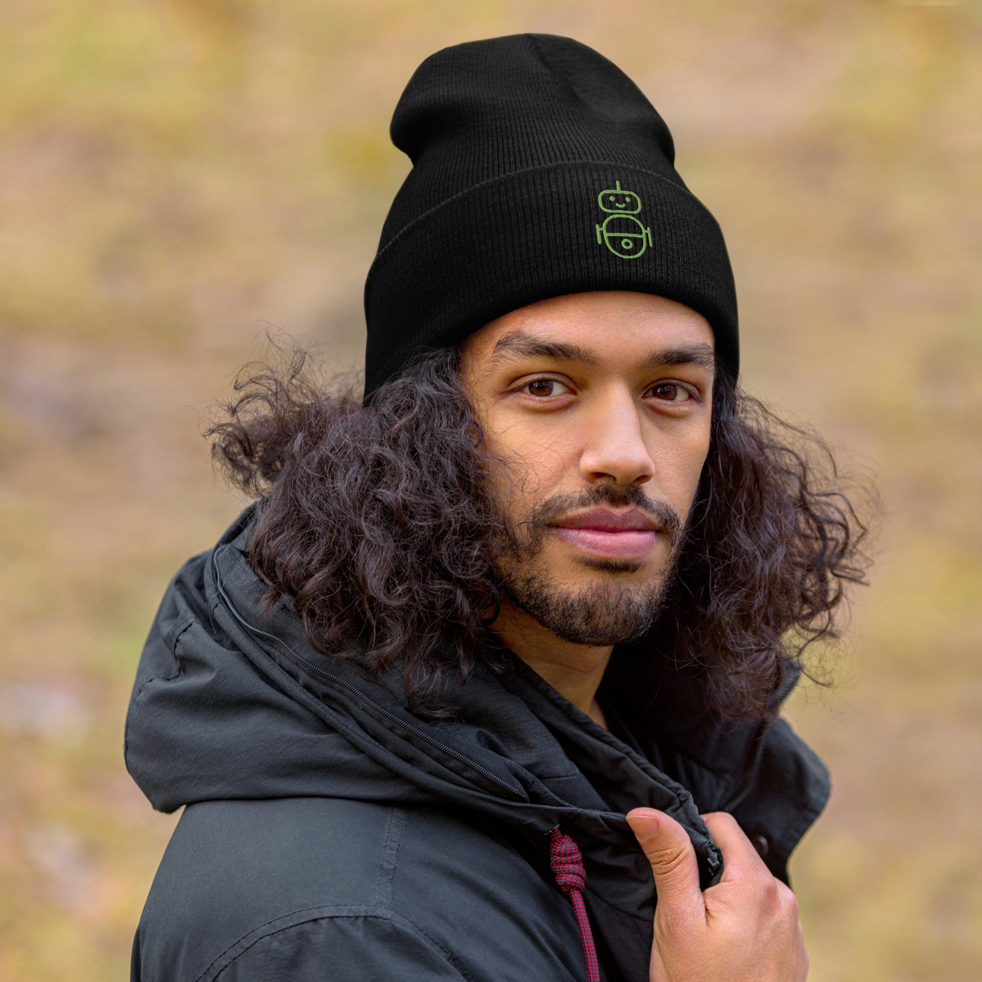 Men with black beanie and Android logo in green