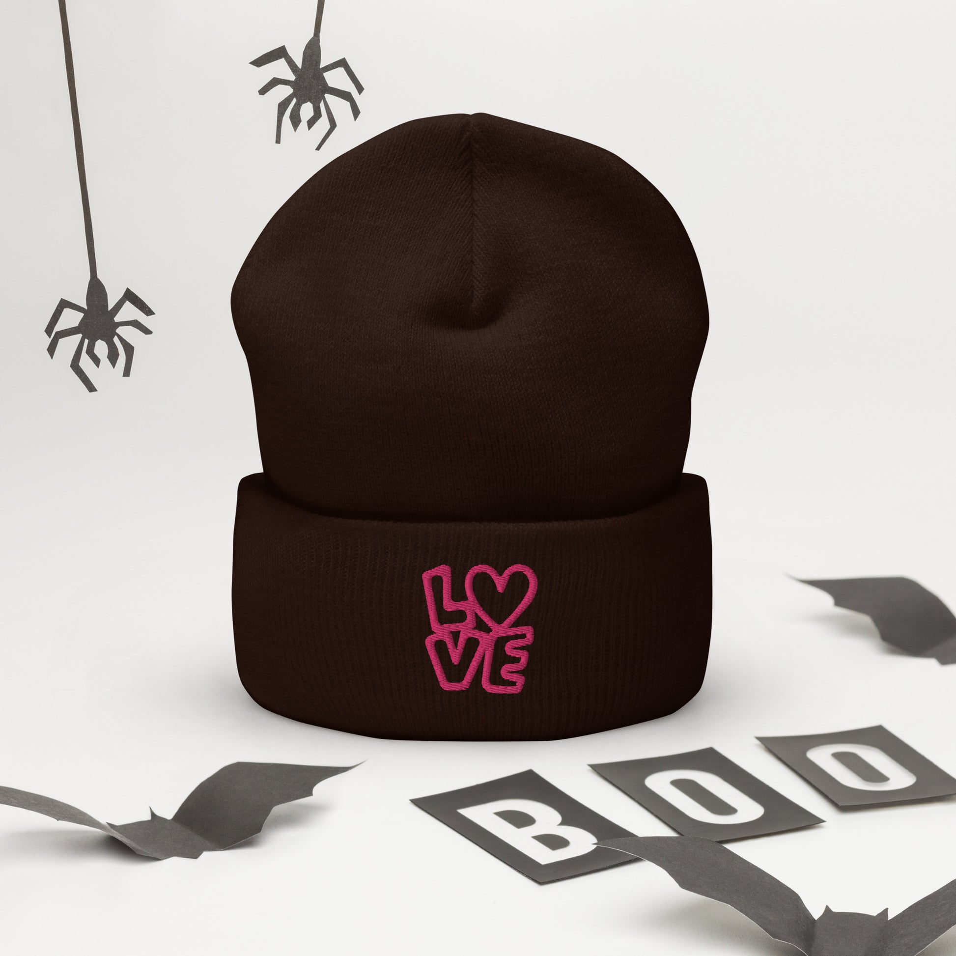 Brown beanie with the pink letters LOVE with the O in heart shape