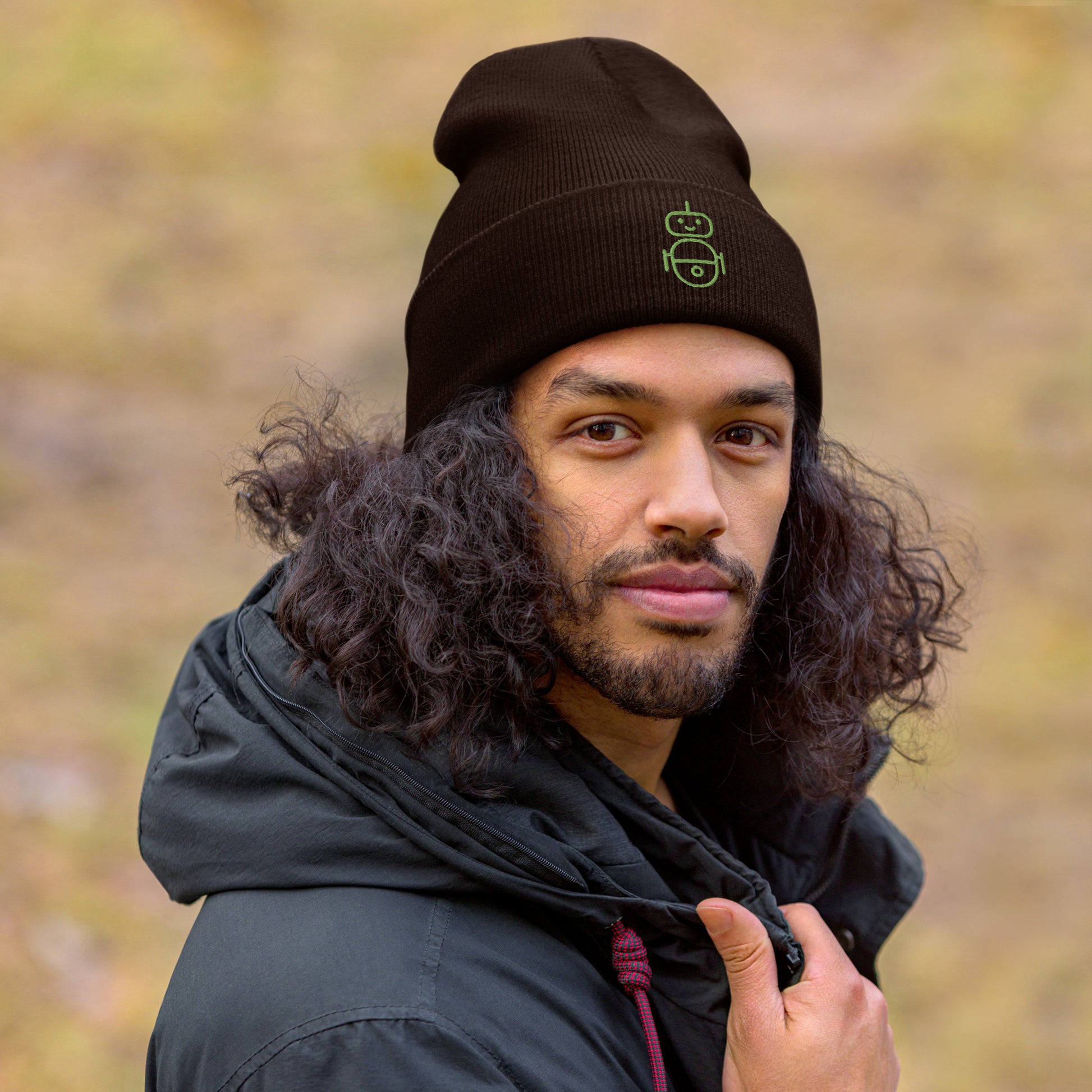 Men with brown beanie and Android logo in green