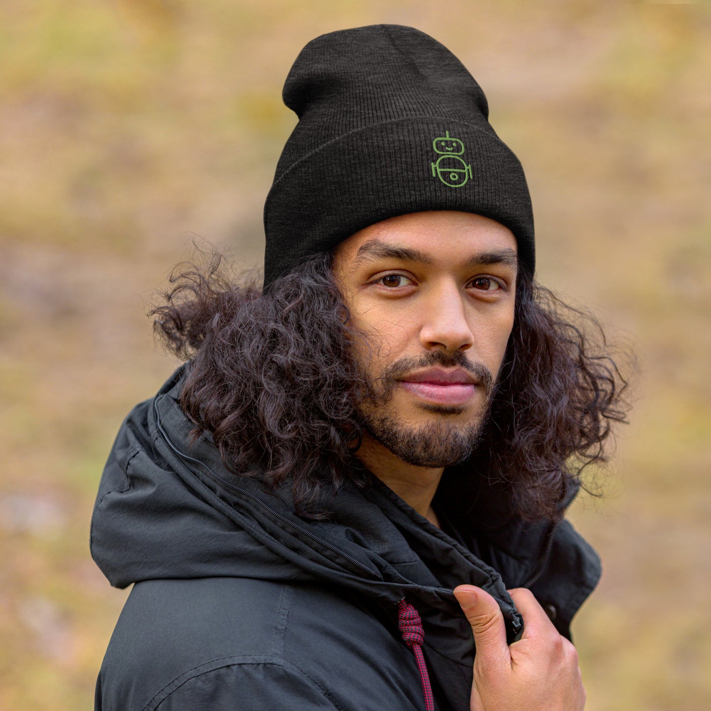 Men with dark grey beanie and Android logo in green