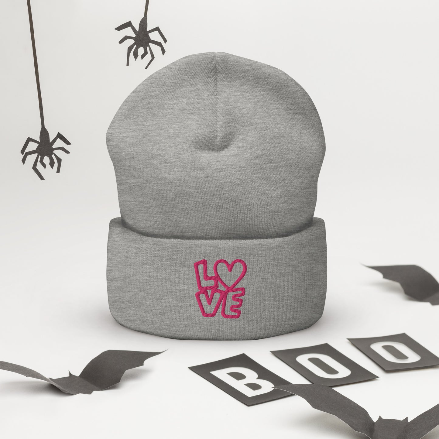 Grey beanie with the pink letters LOVE with the O in heart shape