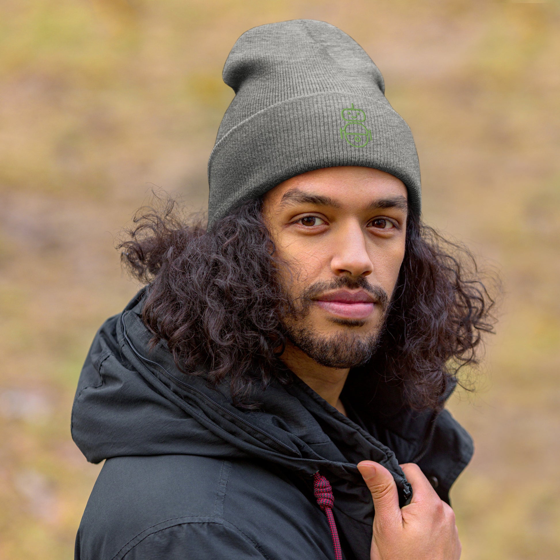 Men with grey beanie and Android logo in green