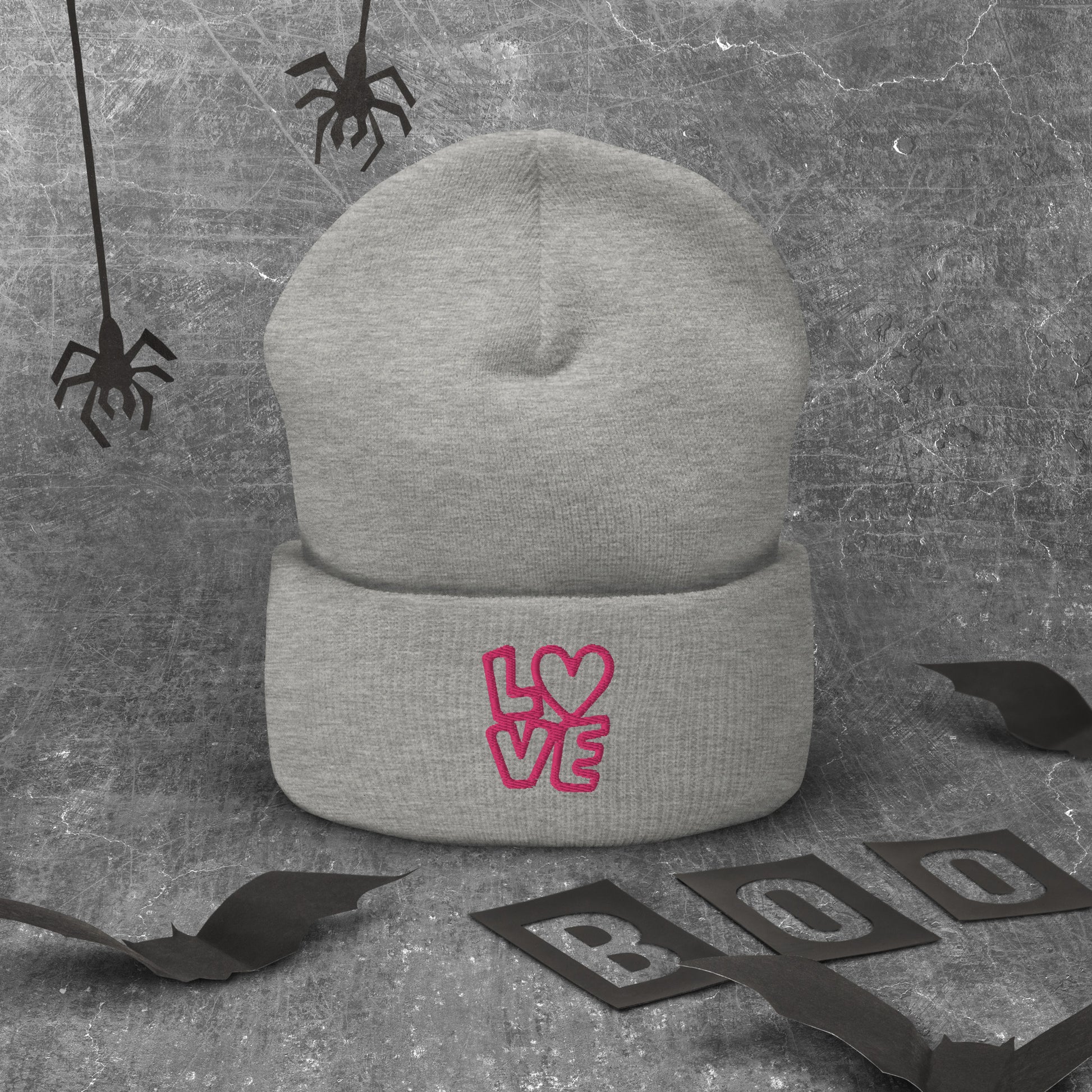 Grey beanie with the pink letters LOVE with the O in heart shape