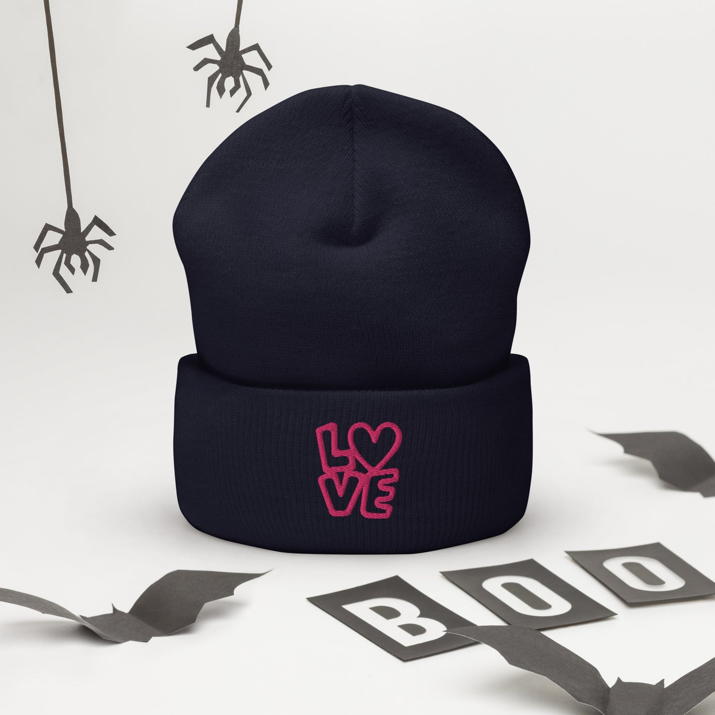 Navy beanie with the pink letters LOVE with the O in heart shape