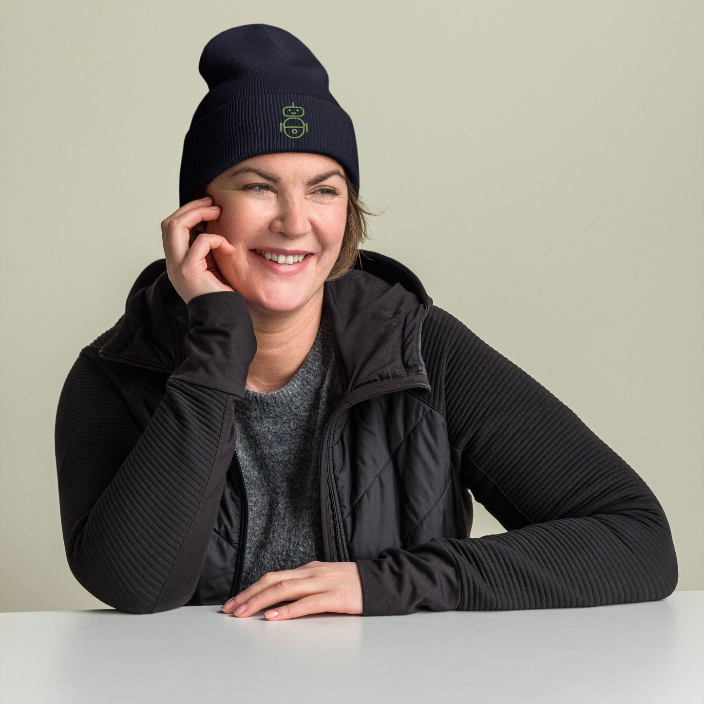 Women with navy beanie and Android logo in green