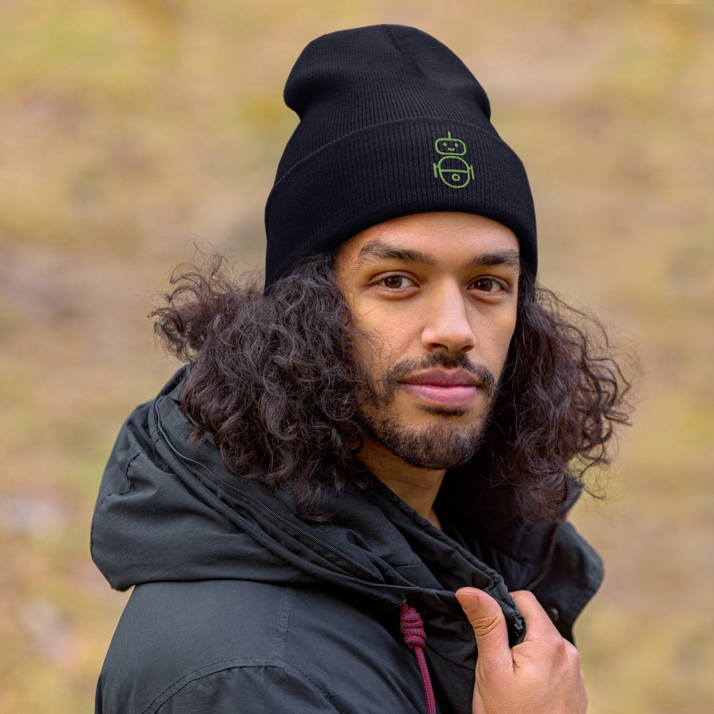 Men with navy beanie and Android logo in green