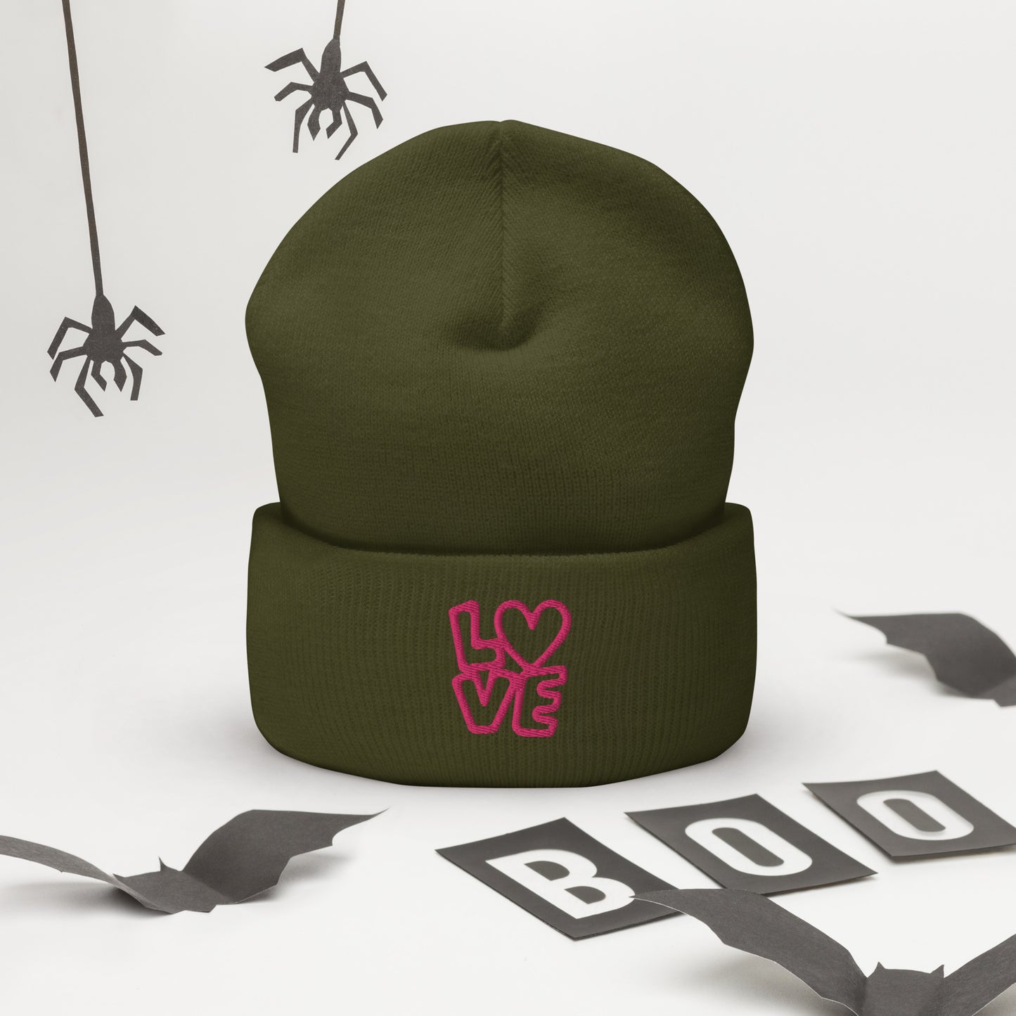 Olive beanie with the pink letters LOVE with the O in heart shape