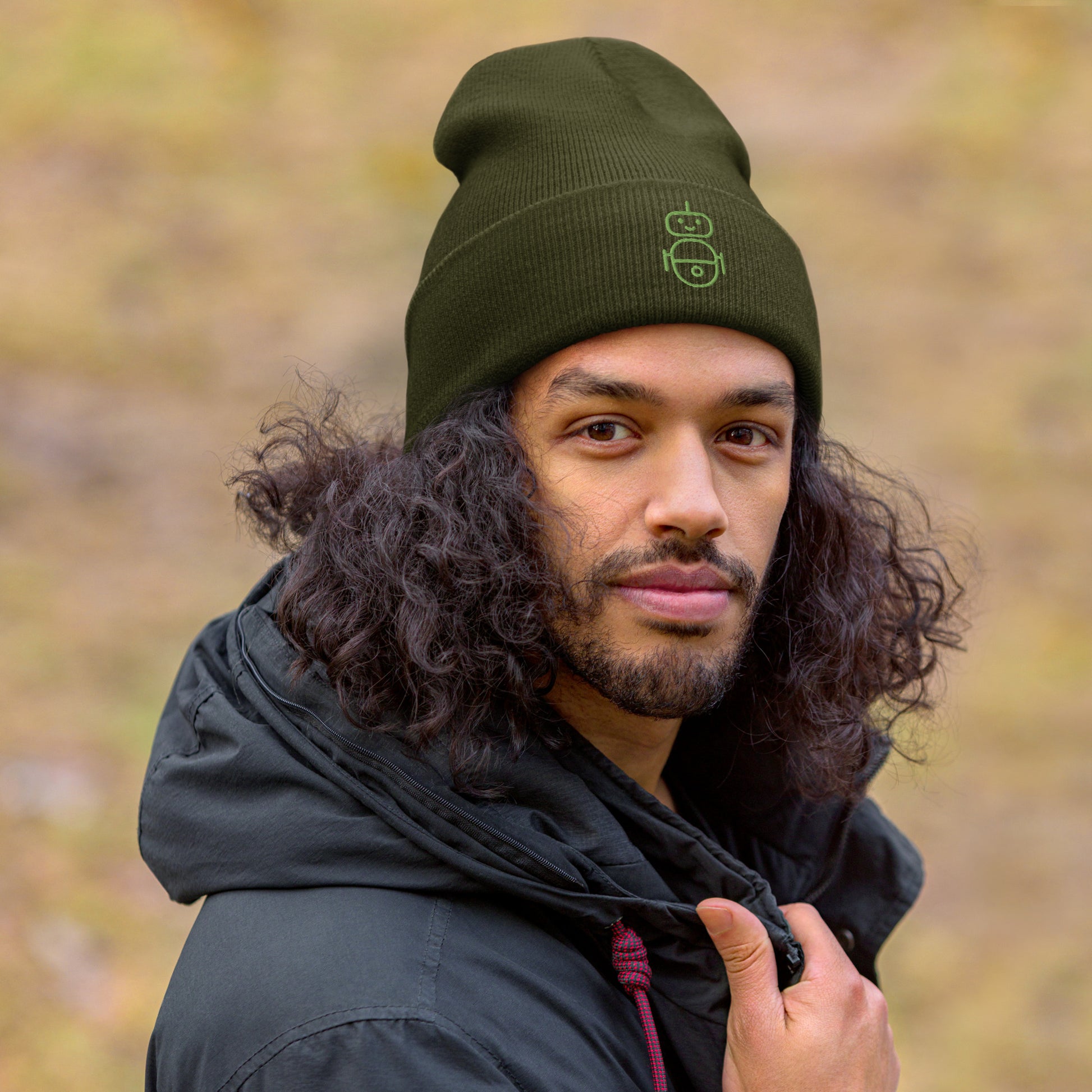 Men with olive beanie and Android logo in green
