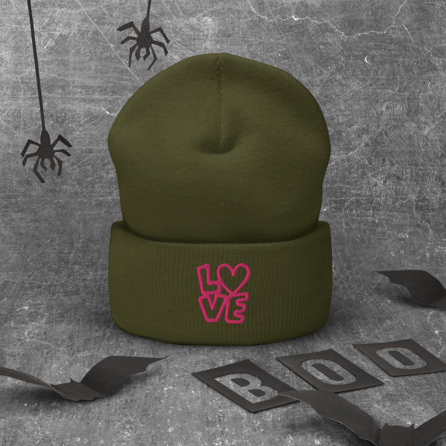 Olive beanie with the pink letters LOVE with the O in heart shape