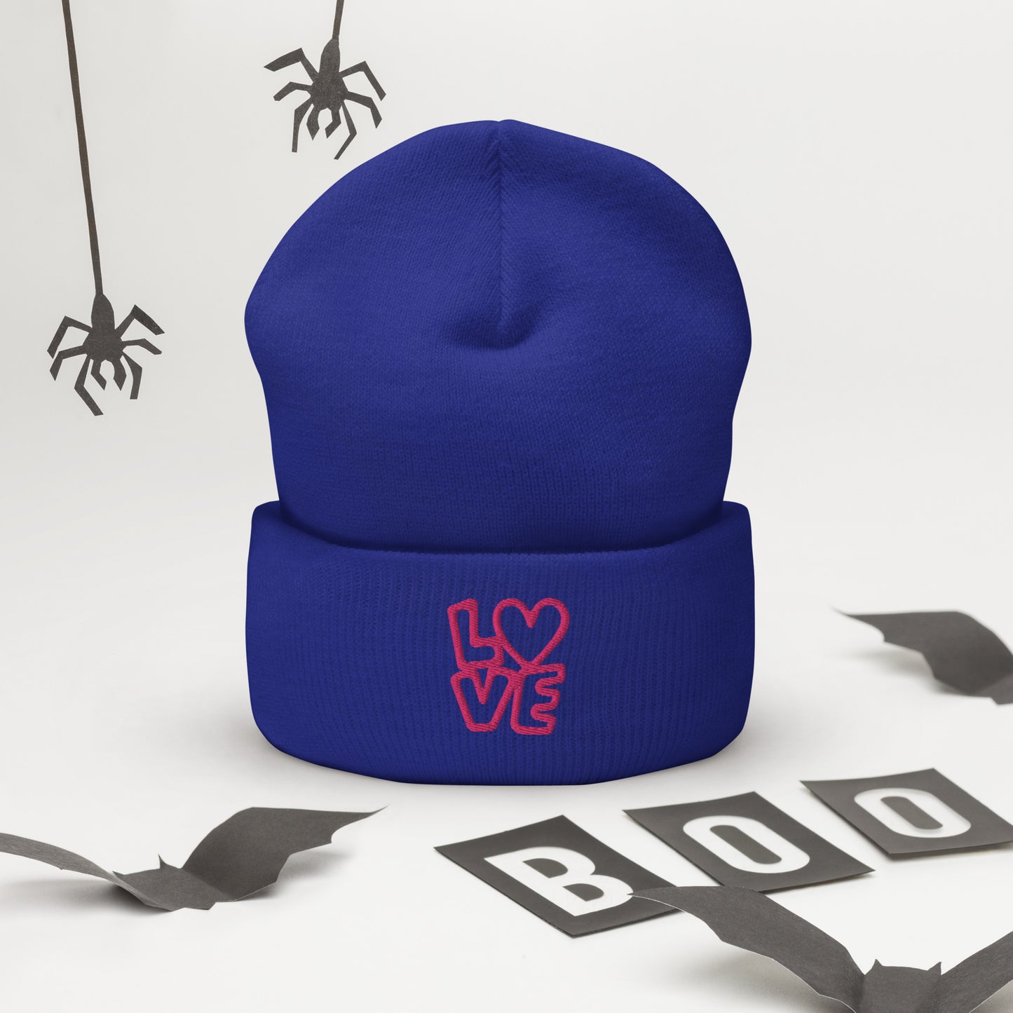 Royal blue beanie with the pink letters LOVE with the O in heart shape