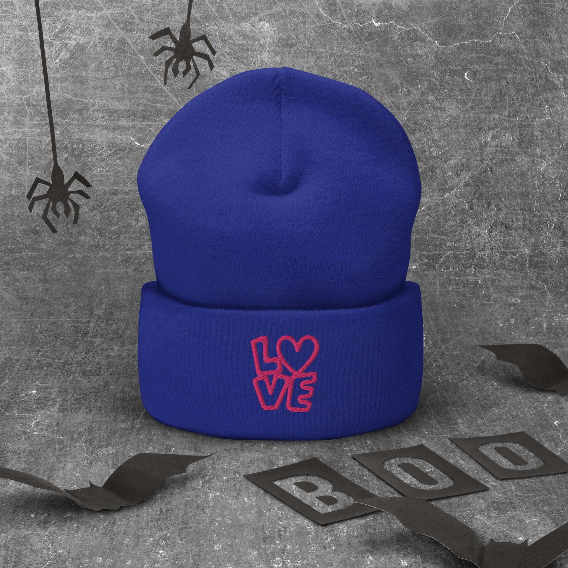 Royal blue beanie with the pink letters LOVE with the O in heart shape