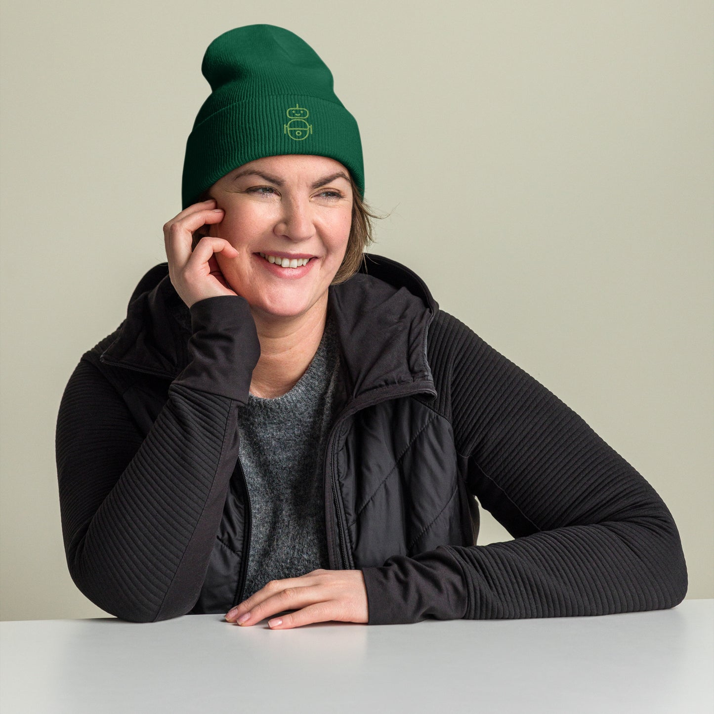 Women with green beanie and Android logo in green