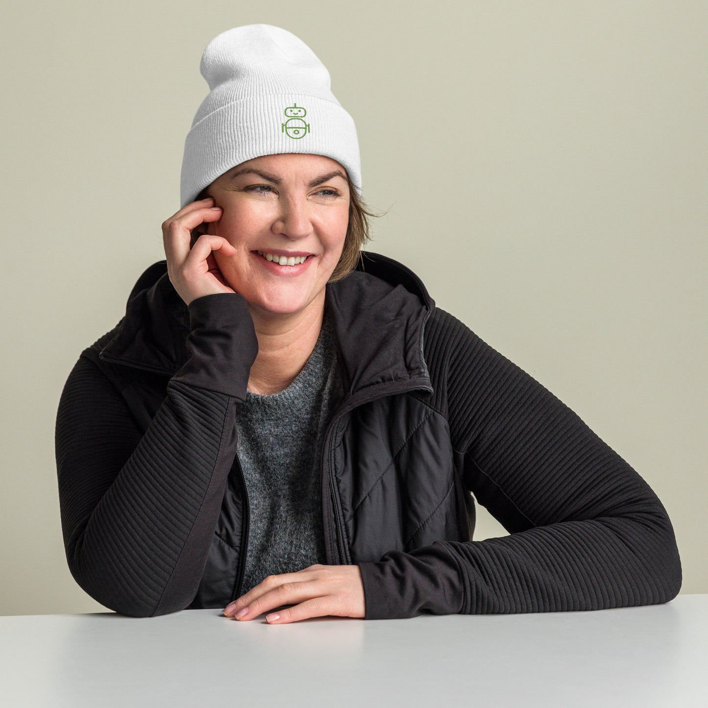 Women with white beanie and Android logo in green