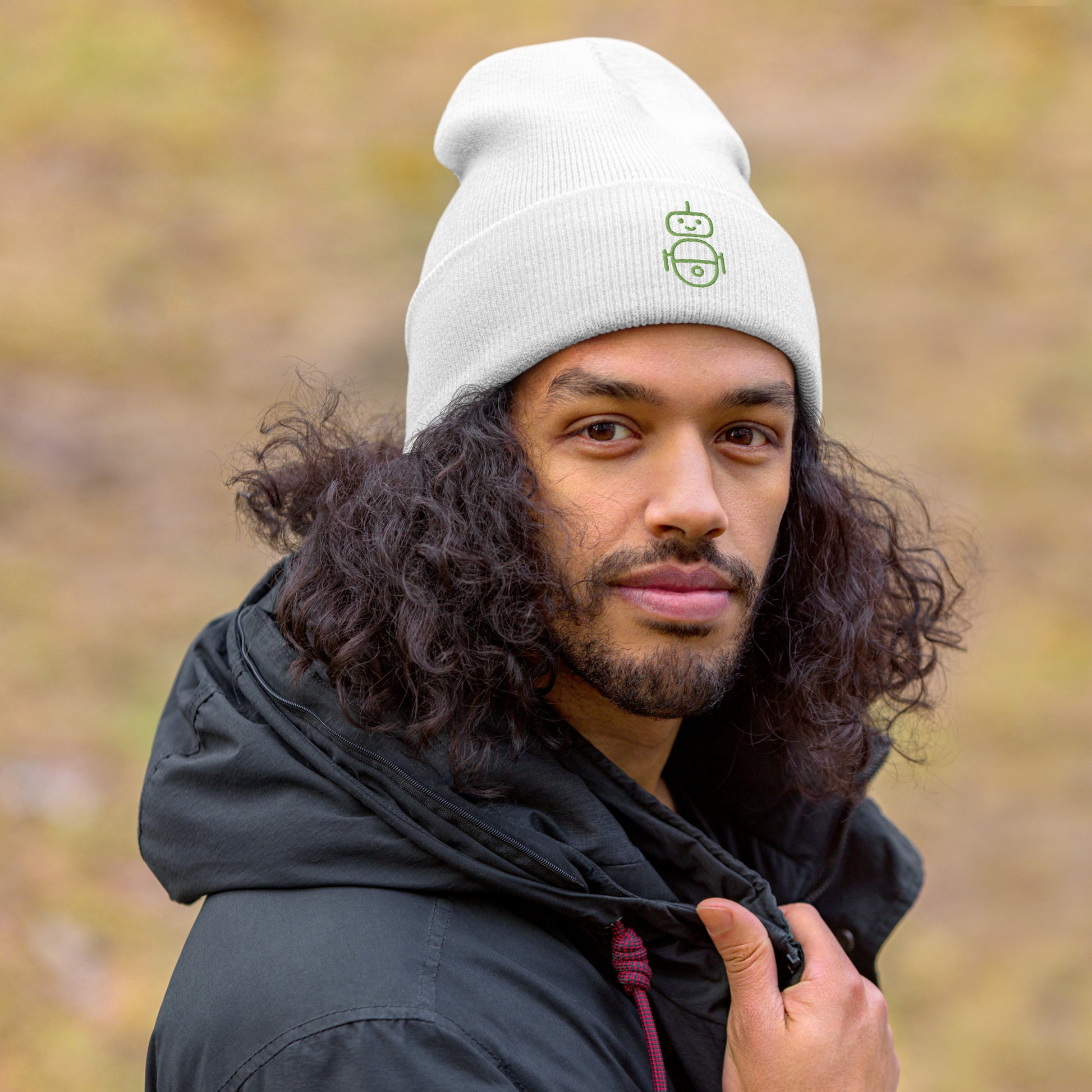 Men with white beanie and Android logo in green