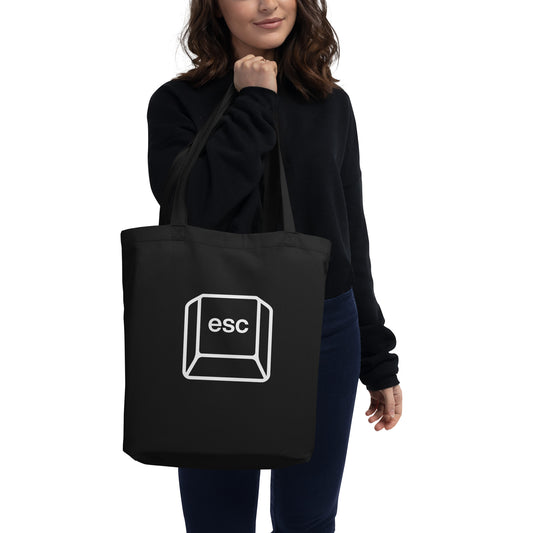 Woman with black tote bag with picture of esc key