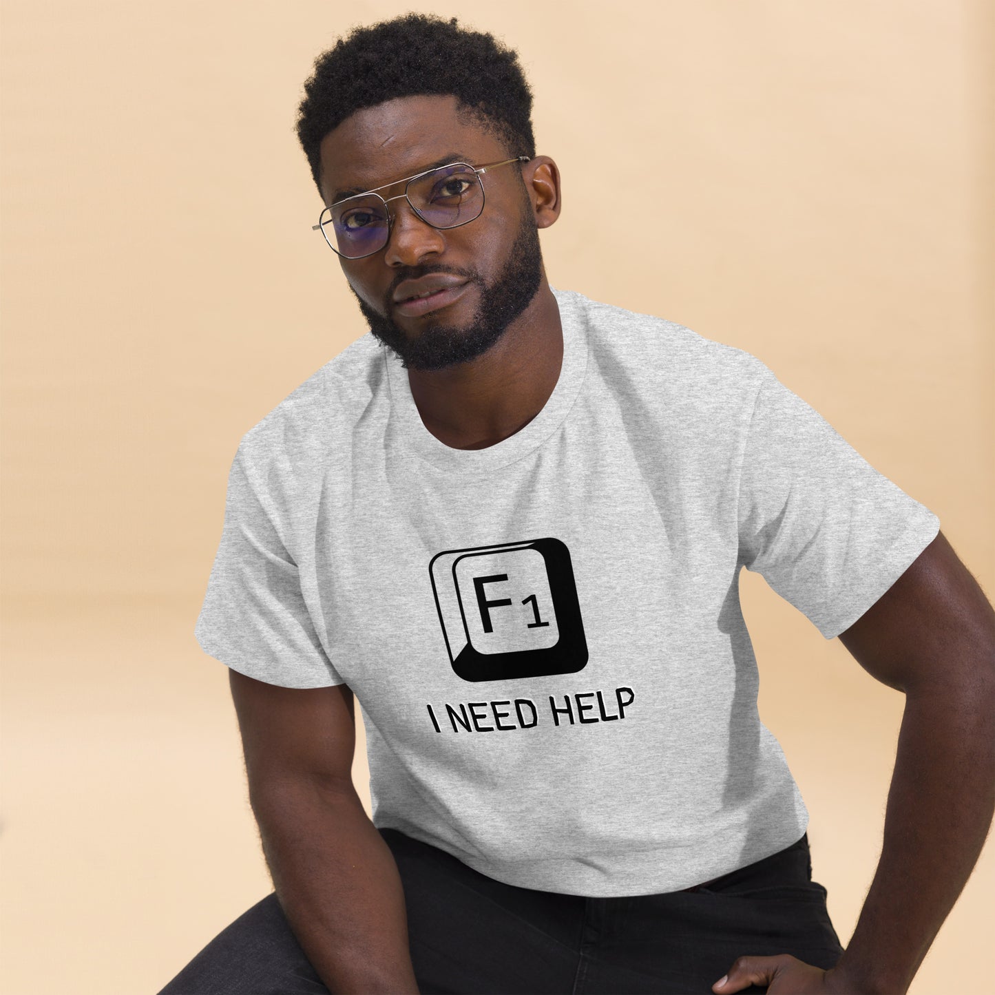 Men with Ash T-shirt and a picture of F1 key with text "I need help"