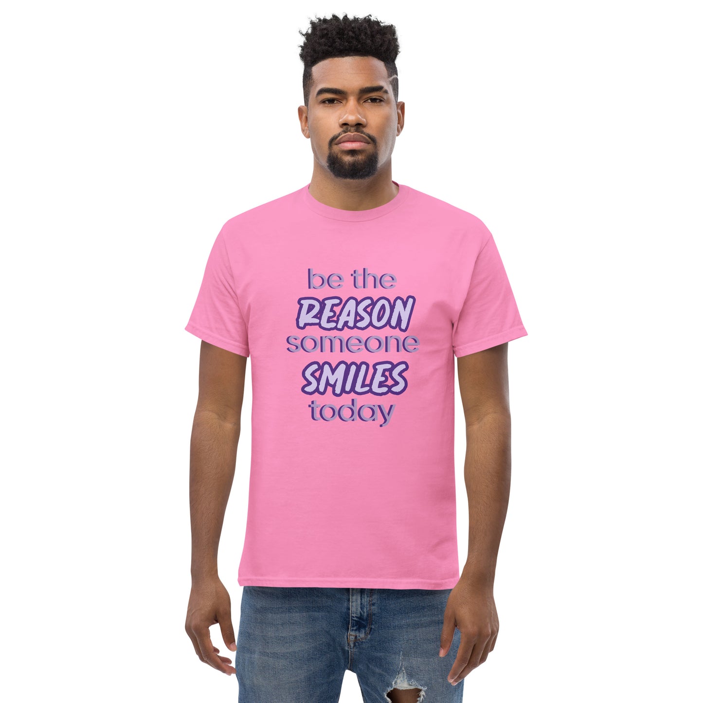 Men with azalea T-shirt and the quote "be the reason someone smiles today" in purple on it. 