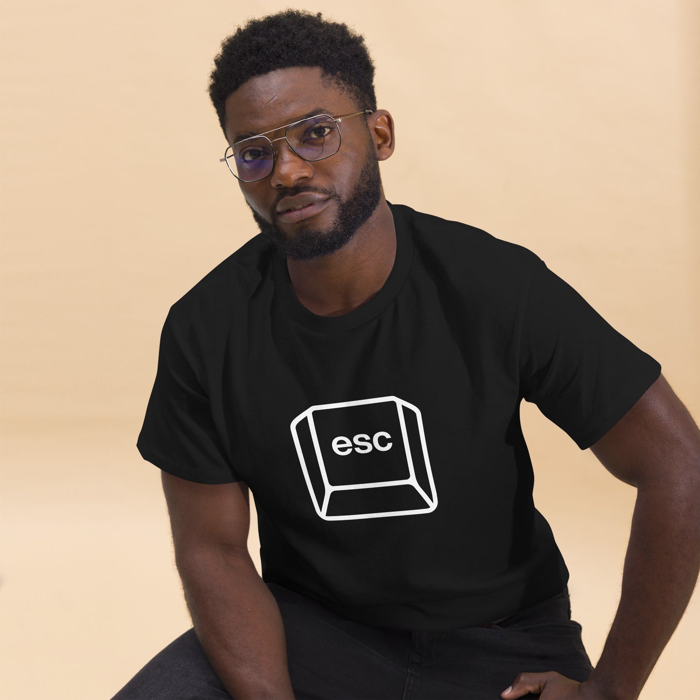 Men with black T-shirt with picture of a esc key