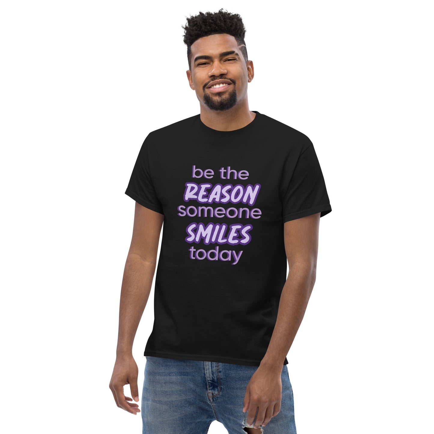 Men with black T-shirt and the quote "be the reason someone smiles today" in purple on it.