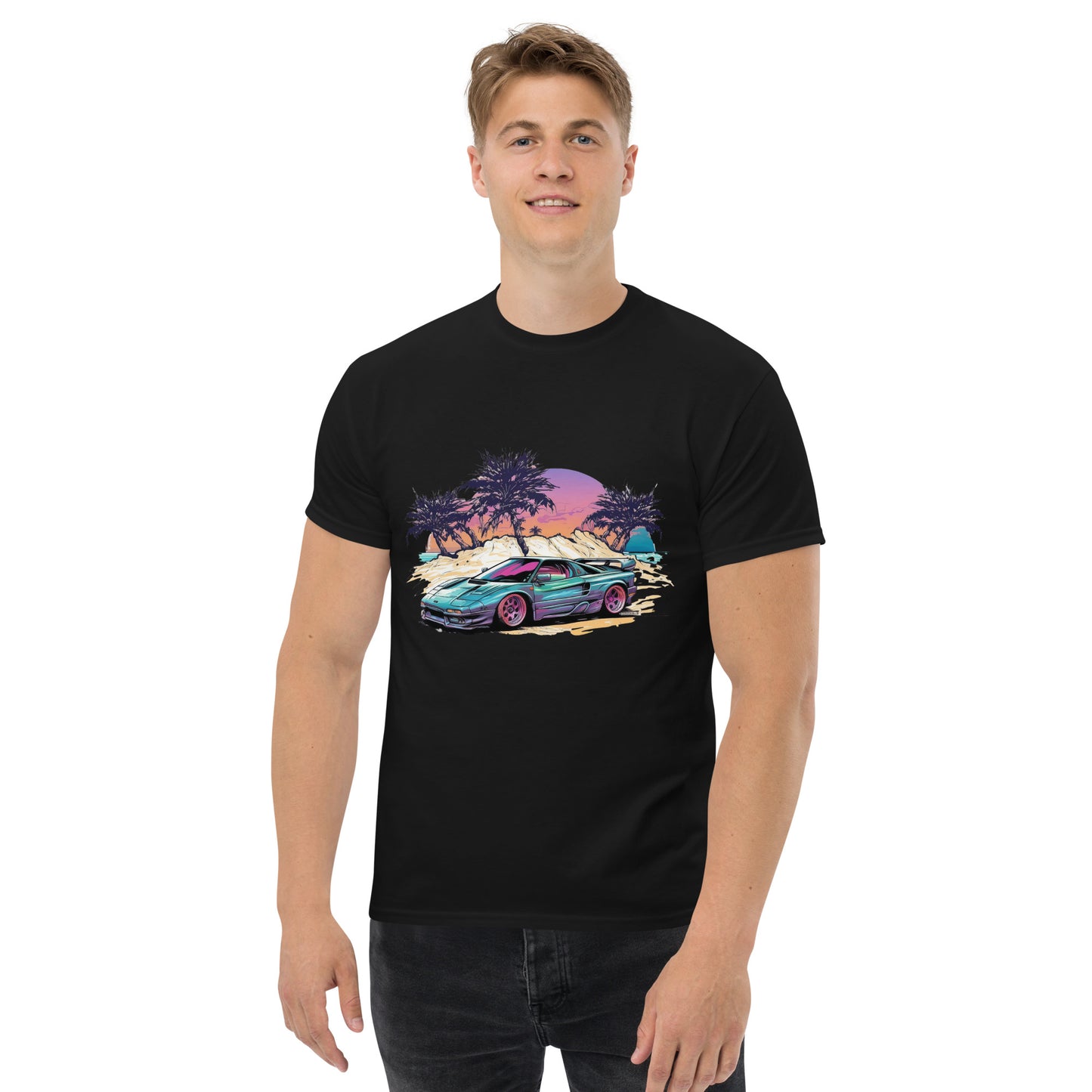 man with black t-shirt with picture of vintage car in front of palm trees